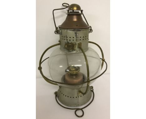 A large Wm. Harvie &amp; Co, Birmingham, marine onion-shaped brass and copper oil lamp. With glass globe, brass cage and hang