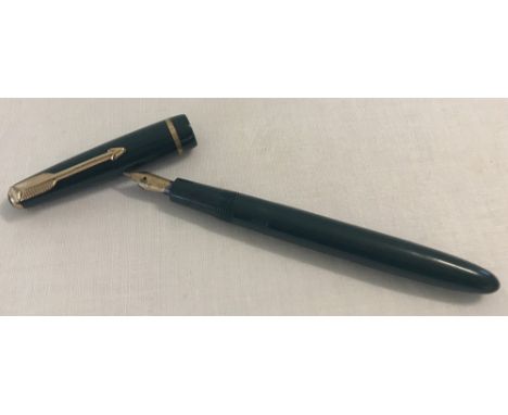 A vintage Parker Slim fold green fountain pen with 14ct gold nib and banding.  