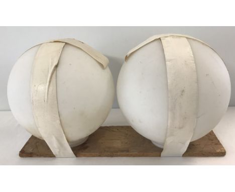 A pair of vintage Holophane ball shaped light shades in white opaque glass.  Approx. 24cm diameter.