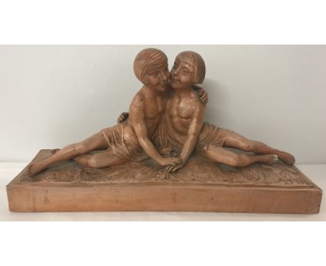 A signed Art Deco terracotta figure group of two sisters. Crack/repair to leg. Item previously purchased locally by antiques 