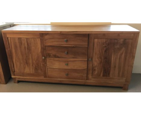 A solid light wood sideboard with 4 central drawers and 2 cupboards.  Approx. 159 x 45cm.