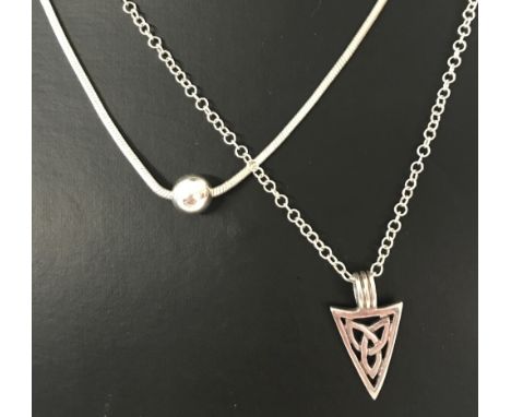 2 silver necklaces. A 16 inch snake chain with sliding ball pendant, has small extension chain. Together with an 18 inch belc