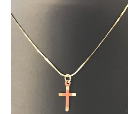 A small  9ct gold cross on a 14inch 9ct gold serpentine chain. Being sold on behalf of Hillside Animal Sanctuary. Approx weig