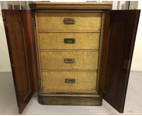 A vintage maple veneer 2 door cupboard with 4 interior drawers. Brass drop down handles set flush into drawer fronts. Origina