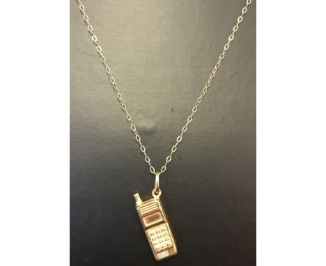 A 9ct yellow gold pendant in the shape of a mobile phone on a fine 9ct gold 18 inch chain. Being sold on behalf of Hillside A