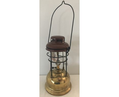 A vintage brass and enamel Tilley Lamp, unused with original instructions.  