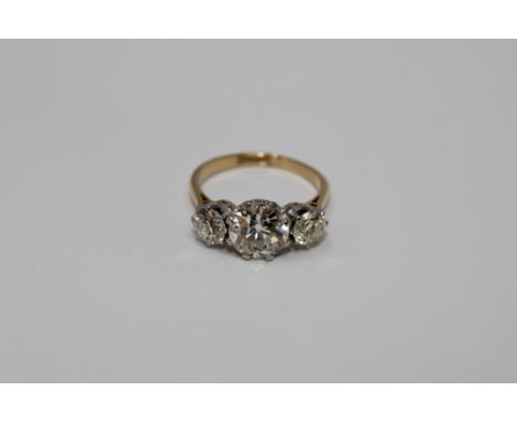 A superb 18ct gold and platinum three stone diamond ring, the principal stone weighing approximately 2.05 carats, approximate