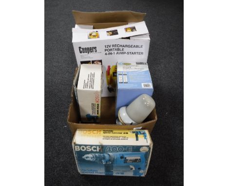 A box of Coopers jump starter, Bosch sander and hammer drill, Powering charge, bulk head light 