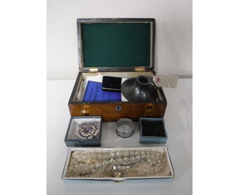 An inlaid wooden table box containing a collection of vintage embroidered handkerchiefs, a Robert Burns booklet, a two-piece 