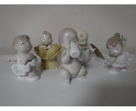 Five Nao figures including three babies, together with two ballet dancers 