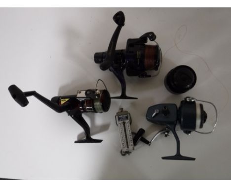 A box containing three spool reels together with a set of Salter pocket scales