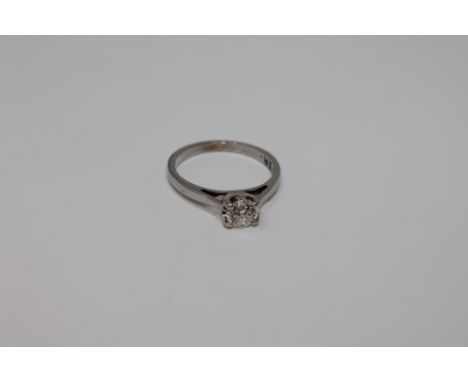 An 18ct white gold diamond solitaire ring, the shank stamped 'Forever'