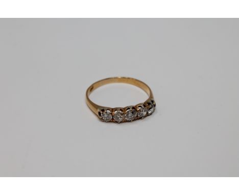 An 18ct gold five stone diamond ring