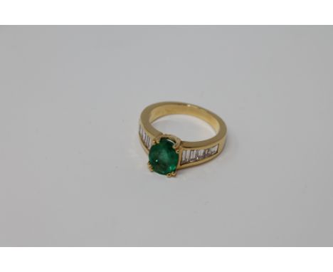 An 18ct gold emerald and diamond ring, size M CONDITION REPORT: The ring is in good condition. It is 6.5g. The emerald is eve