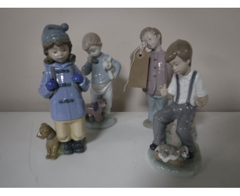 Three Nao figures of boys together with a Nao figure of a girl (4)