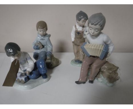 Four Nao figures including boy with train, boy with accordion etc (4)