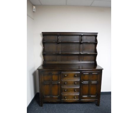 An Ercol dark oak dresser 