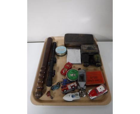 A tray containing a policeman's truncheon, a Nikko sterling air rifle scope, air rifle pellets, field glasses, die cast cars,