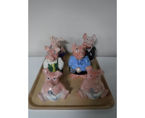 A tray containing a set of six Wade Natwest pigs