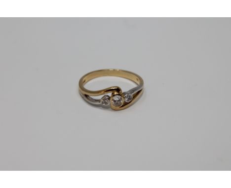 An 18ct gold three stone diamond ring