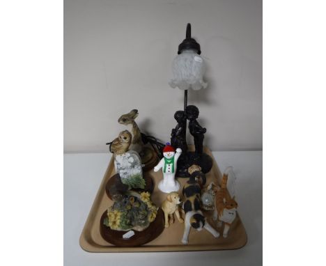 A tray of Tiffany style table lamp, three Border Fine Arts figures on wooden stands, Ringtons Snowman etc 