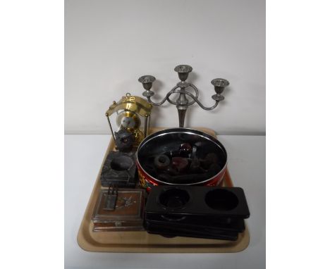A tray of plated candelabra, anniversary clock, large collection on pipes, trinket box, Bakelite ash trays etc 