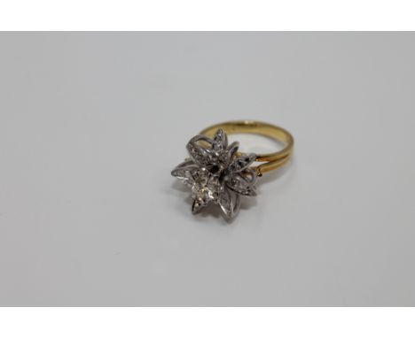 An 18ct gold diamond set ring, the principal stone weighing an estimated 0.3 carat, 7.4g