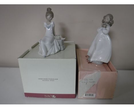 Two Nao figures, 'Girl Seated', 'Girl Holding Flower'(boxed)