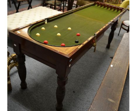 A late Victorian mahogany bagatelle table, by Orme & Sons, Manchester, late 19th century, the hinged lid opening to reveal a 