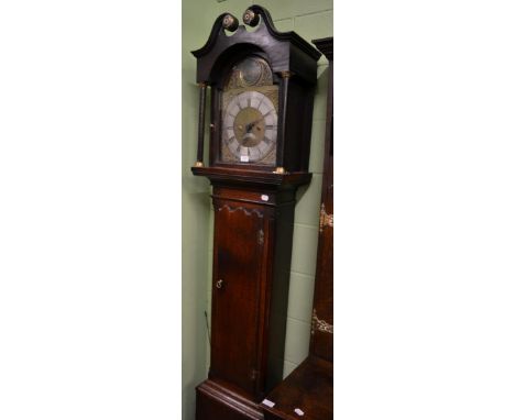 An oak thirty hour longcase clock, signed Mark Metcalfe, circa 1770, swan neck pediment, triple arched trunk door with a Bria