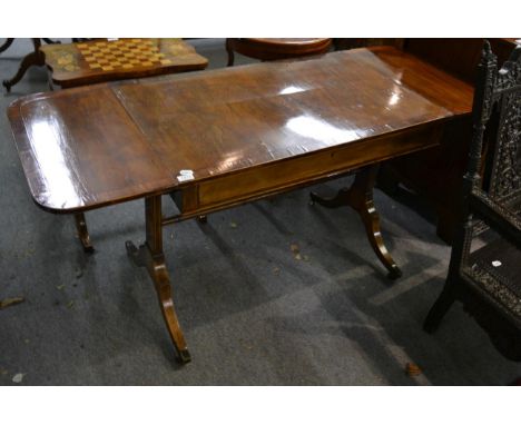 A Regency mahogany, rosewood and ebony strung sofa table, early 19th century, with one real and one sham drawer, raised on st