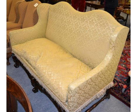 A Victorian carved mahogany double hump back sofa in 18th century style      