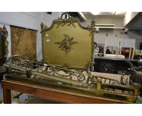 A 19th century brass fender, a French style firescreen and another brass fender      