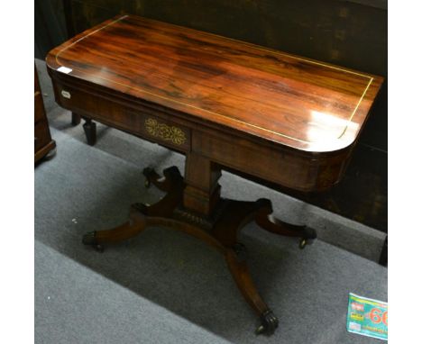 A Regency rosewood and brass inlaid fold over card table      