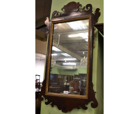 A reproduction walnut Vauxhall style rectangular mirror, gilt Greek key slip, fretted cornice and base, 92cm high       