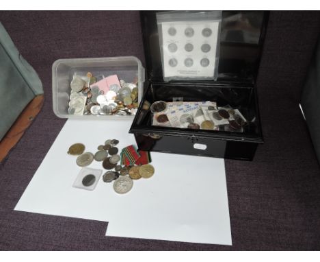 A collection of World Coins in plastic tub and a collection of Fantasy and copy Coins in cash box and a small box containing 