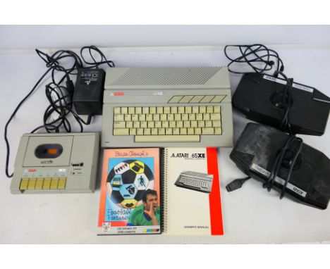 Atari - An unboxed vintage Atari 65XE personal computer (has owners manual) with an Atari XC12 Progam Recorder, two Atari 'Tr