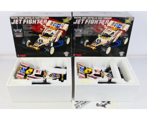 Taiyo - A pair of boxed Taiyo #8714-27 Radio Control 'Jet Fighter' Off-Road Racers. The models have some very light age relat