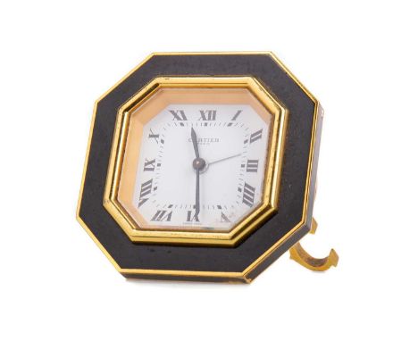 DESK TIMEPIECE OF ART DECO DESIGN BY CARTIER,brass cased with black enamel, the octagonal dial set with Roman numerals and si
