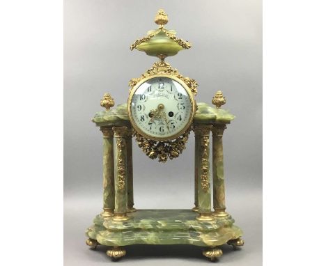 19TH CENTURY FRENCH ONYX MANTLE CLOCK,of architectural form with gilt metal mounts, the dial set with Arabic numerals and sig