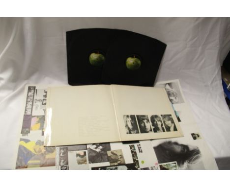 A low numbered top opening Beatles White album with poster - decent copy in VG+ / VG+ vinyl and sleeve in VG with some light 