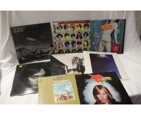 An eight album lot with records by the Rolling Stones , Tom Petty and more on offer here