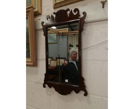 A late 19th/early 20th century wall mirror in Chippendale style fretwork frame 