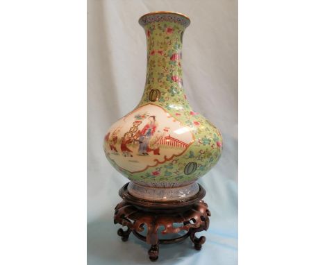 A late 19th/early 20th century Chinese squat baluster vase with long slender neck and raised foot, all over decoration in the