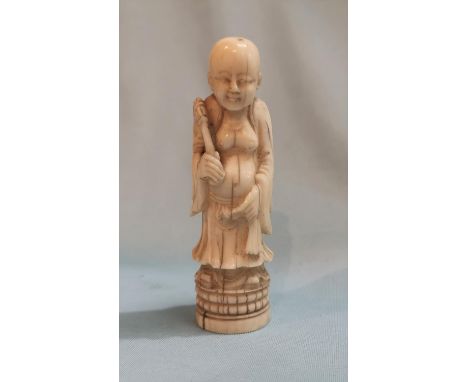 A late 19th / early 20th century Chinese carved ivory handle to a walking stick depicting a bald figure 9.5cm