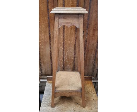 A 1920's oak 2 tier plant stand and a similar turned standard lamp