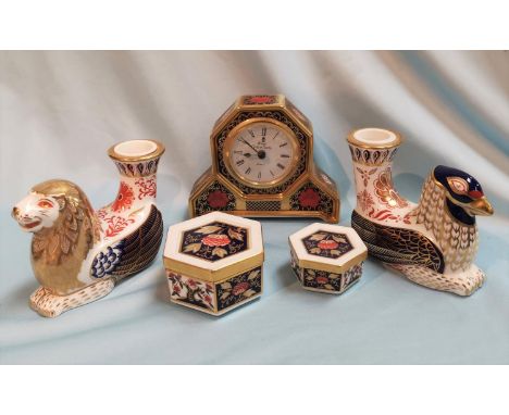 A two Royal Crown Derby candlesticks "Griffin" LI and Eagle LI (no stoppers); an "Old Imari" clock LV (a.f.); 2 hexagonal box