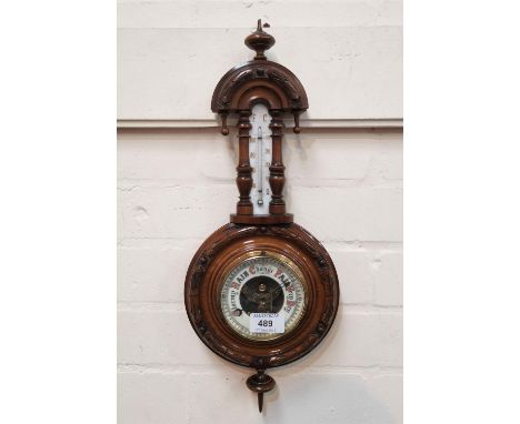 A late 19th century barometer/thermometer in banjo shaped case, 46 cm 