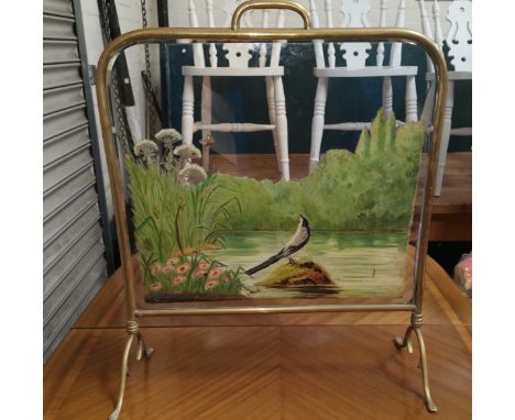 A Victorian brass firescreen with bevelled glass and painted river scene 