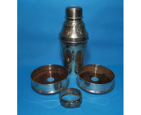 A pair of silver and wood coasters, London 1991; a silver bangle; a silver plated cocktail shaker